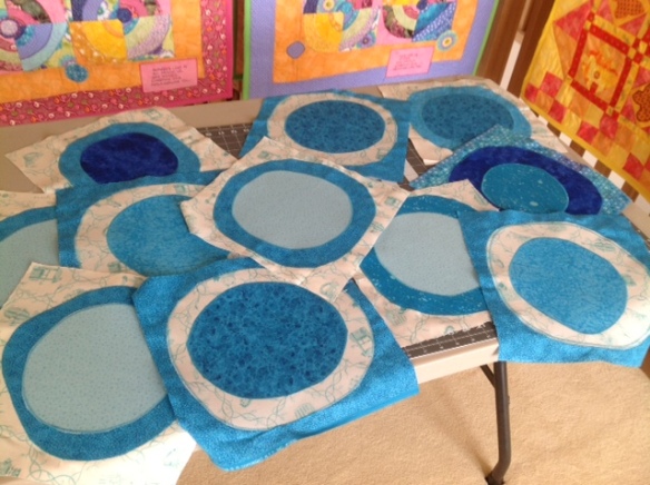 Appliqued blue and turquoise circles. 